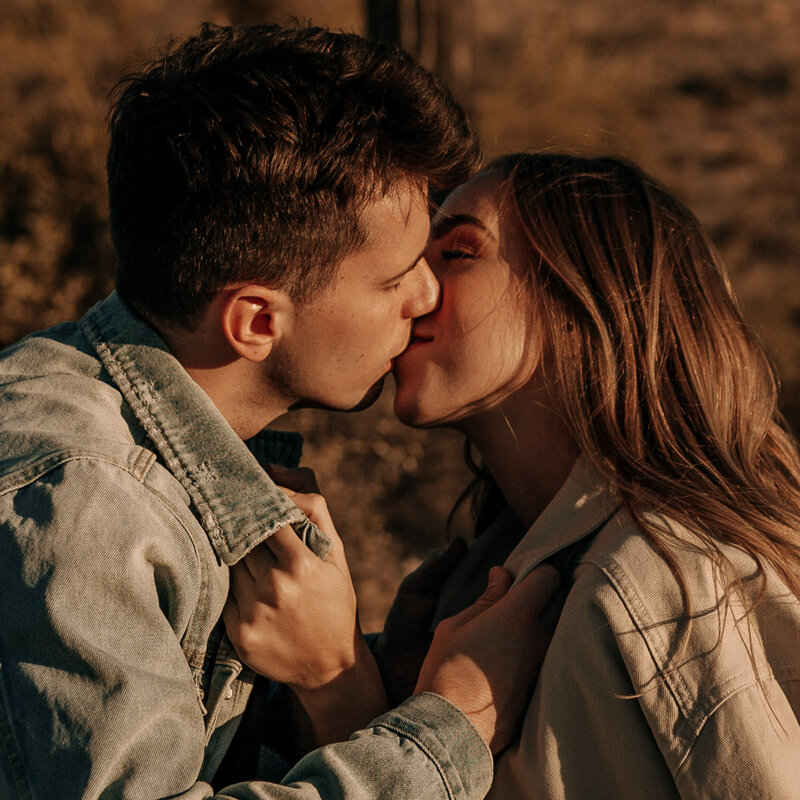 couple in denim jacket for engagement session at lost dutchman state park