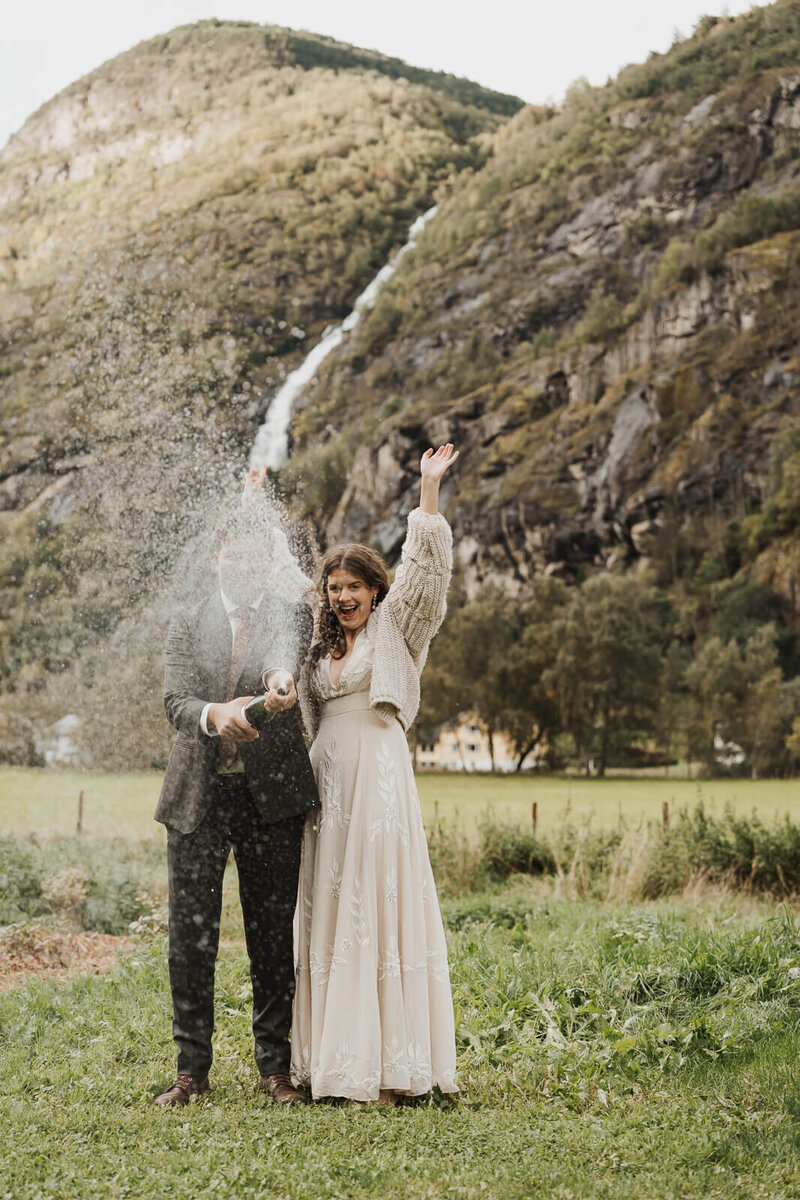 wedding couple spraying champagne 