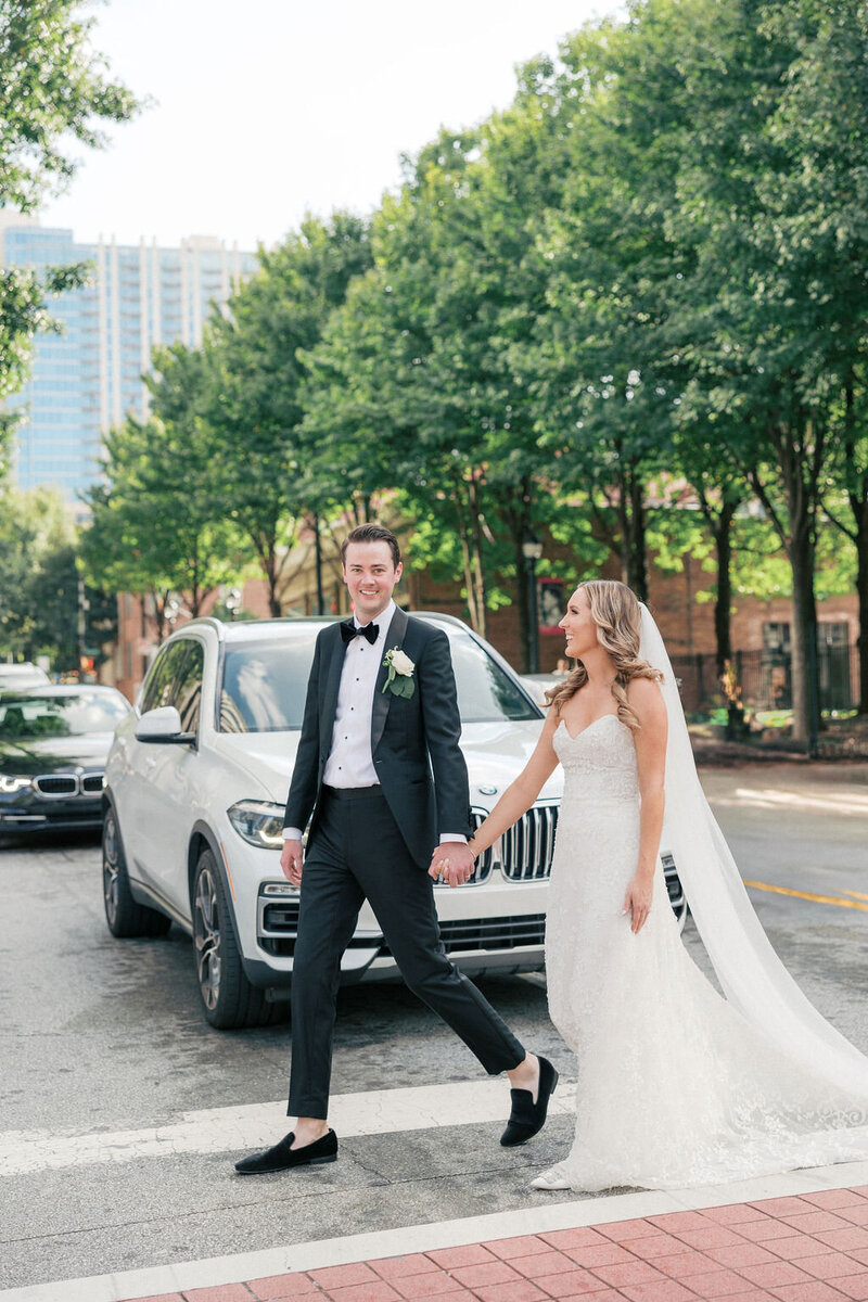 Bride and groom walk through the streets of downtown Atlanta
