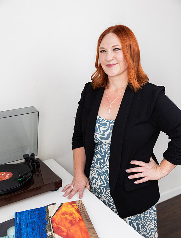 RaeAnn Stout, QuickBooks ProAdvisor and bookkeeper in San Diego, photographed beside her record player photo by Marcy Browe