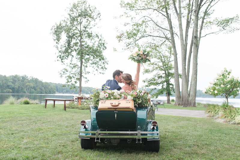 NJ Wedding Photographer bride and groom send off in vintage car.