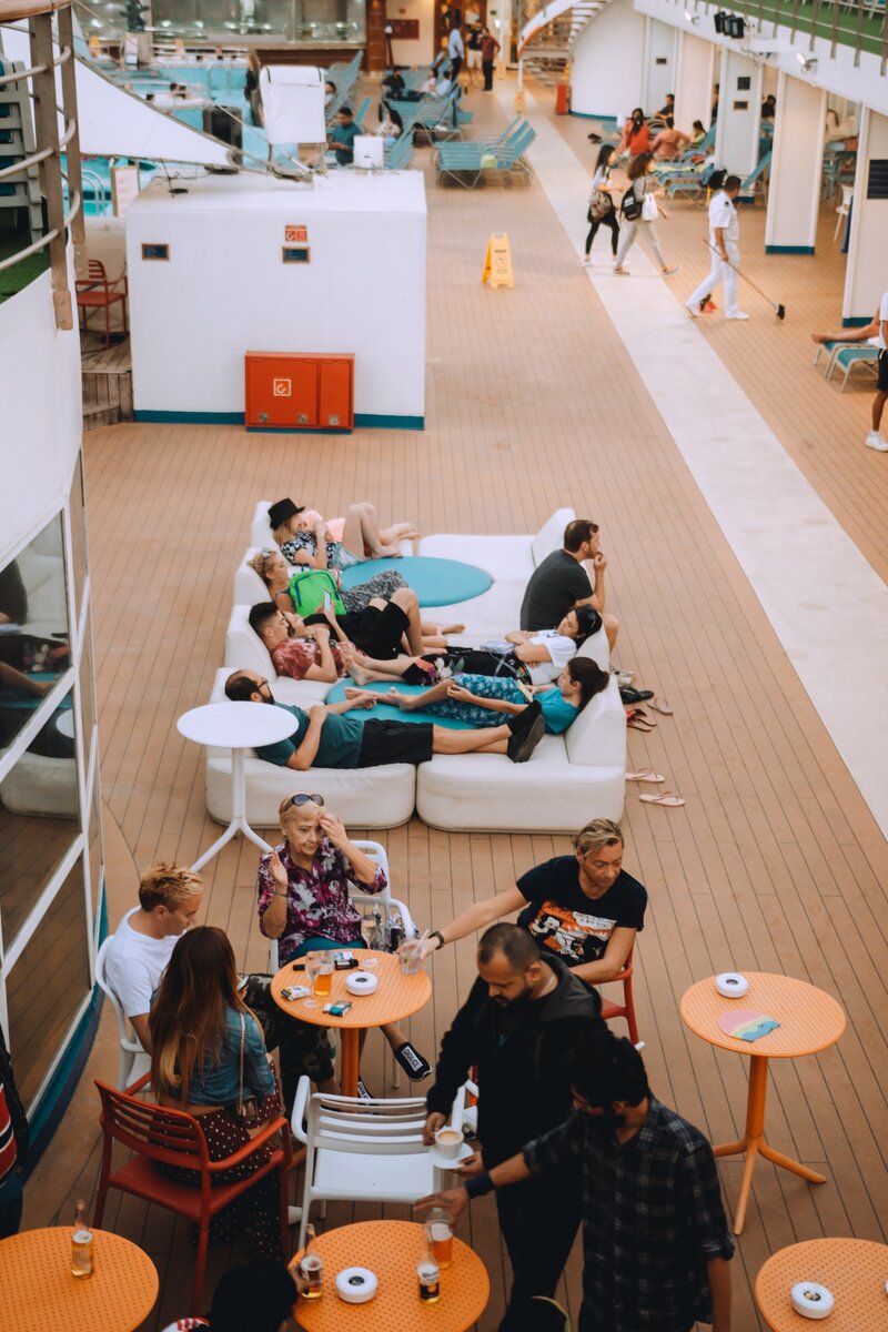 Group of people relaxing on cruise deck