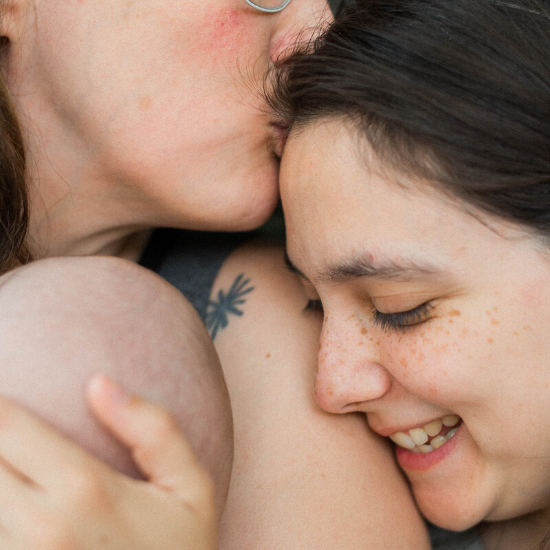 Two moms holding their newborn