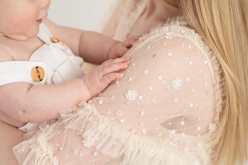 Close up of 1 year old baby hands touching mom for Maryland Portrait Photos