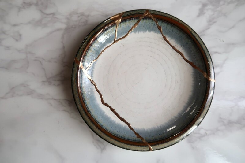 broken bowl fixed with gold bonding kintsugi