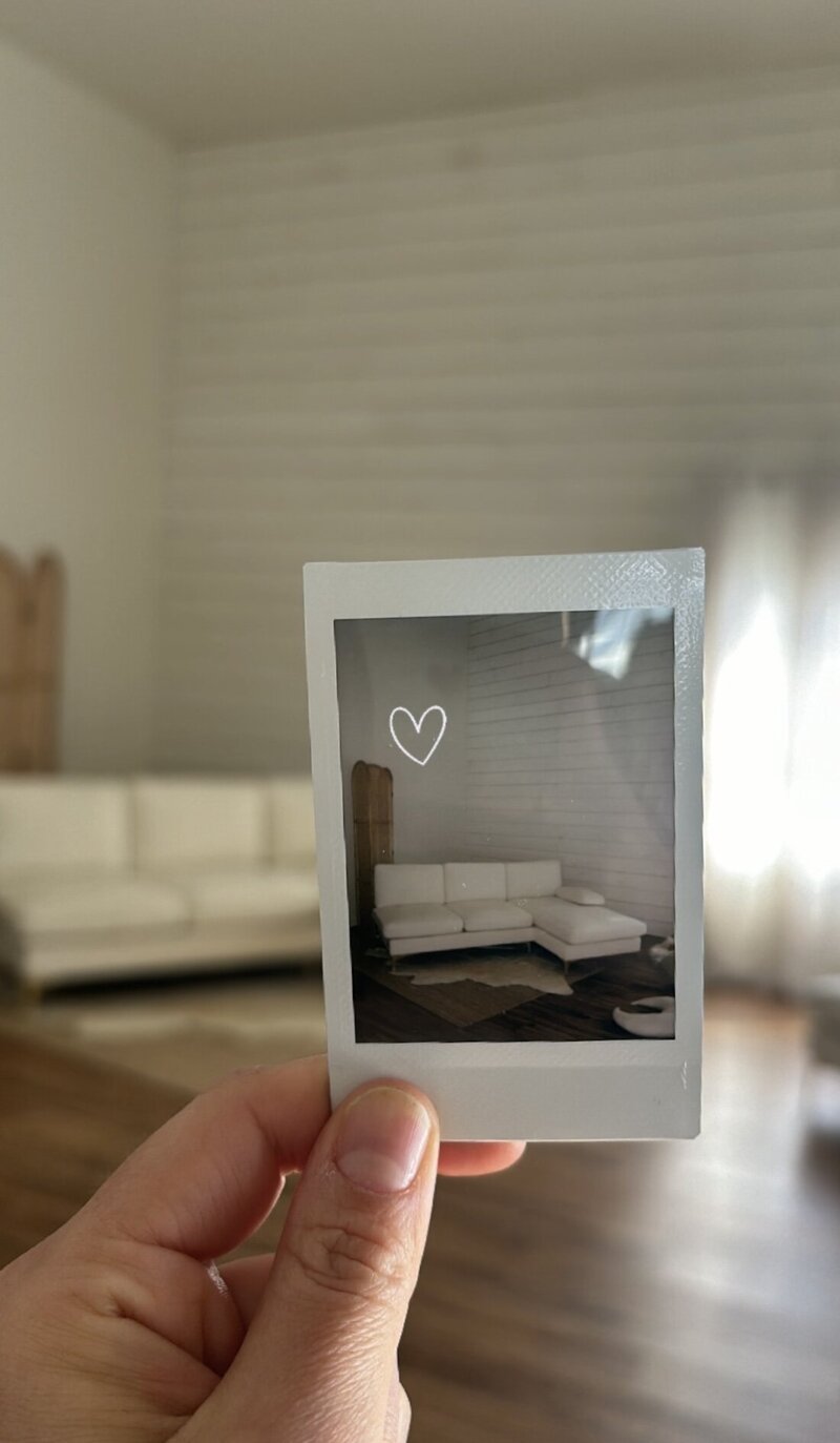 polaroid photo of a white couch