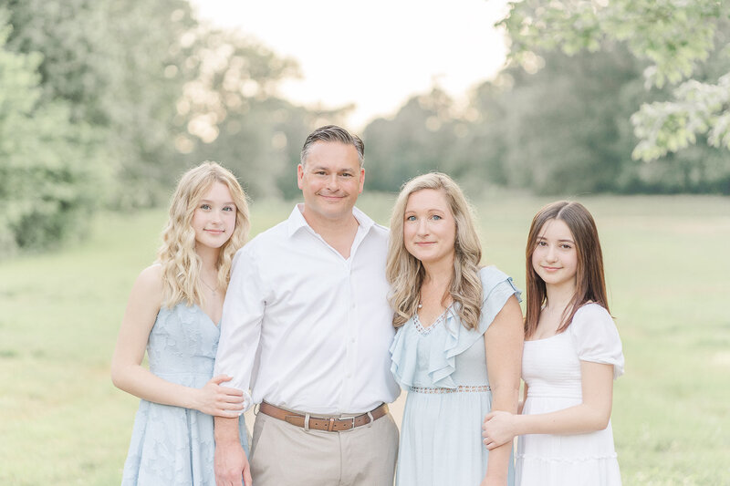 family of 4 posing for photos taken by Chantilly, Virginia spring mini session photographer