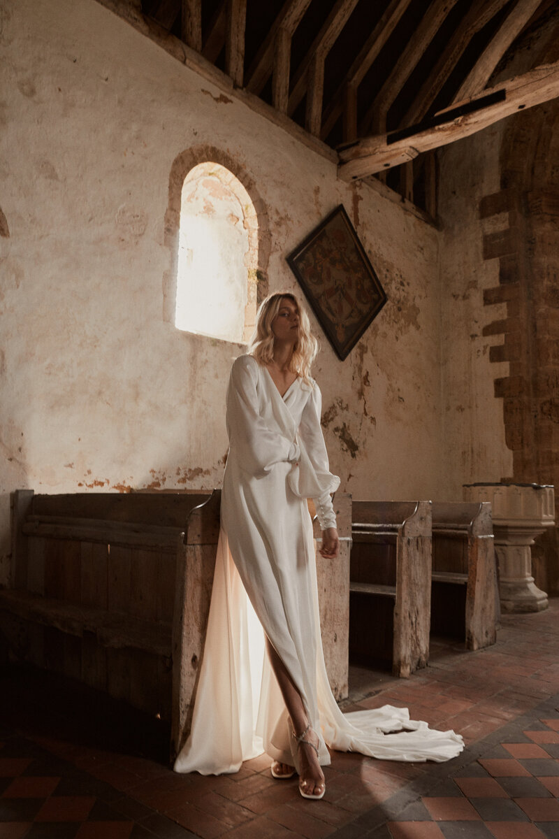 Vanity fair bride wearing v-neck pure silk wedding dress, handmade by British designer Luna Bea