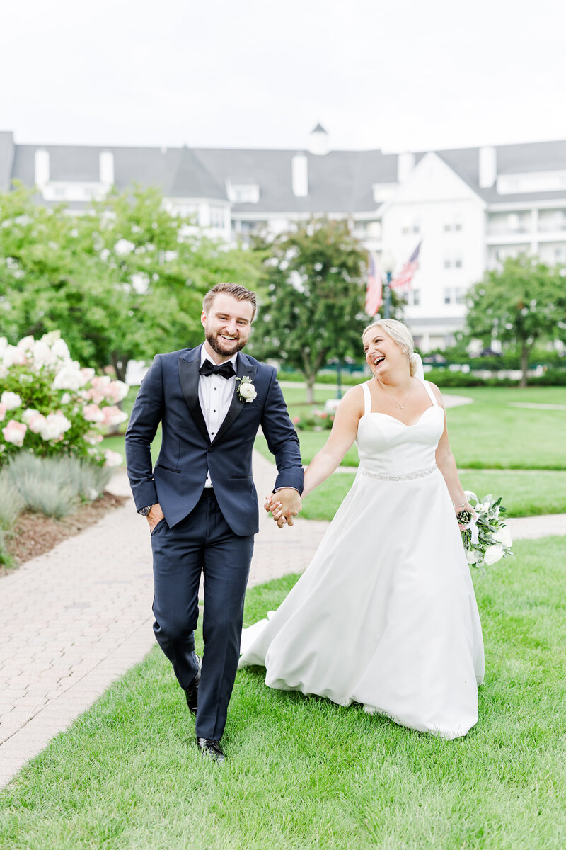 bride_and_groom_walking_and_laughing_together