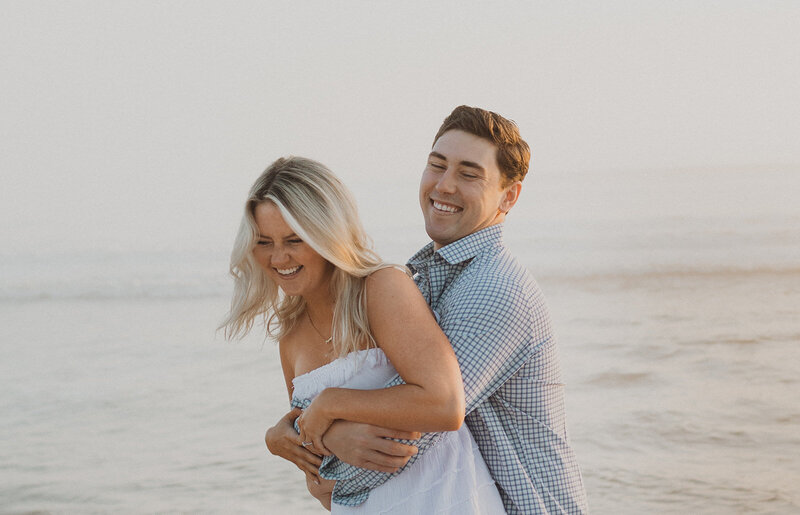 Couple leaning in for a kiss while smiling