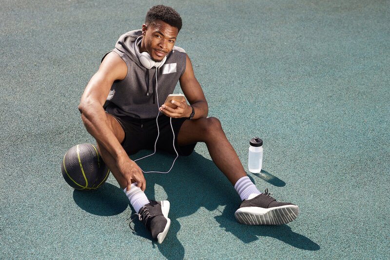 athlete after a workout listening to music on headphones
