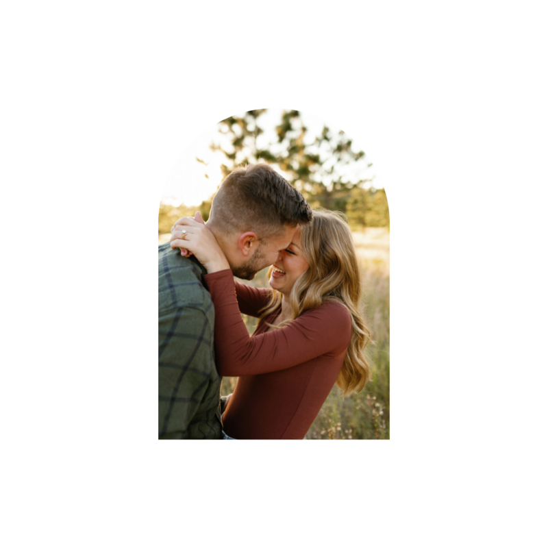 Couple sitting on a dock holding hands