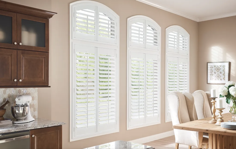 White custom shutters dining room