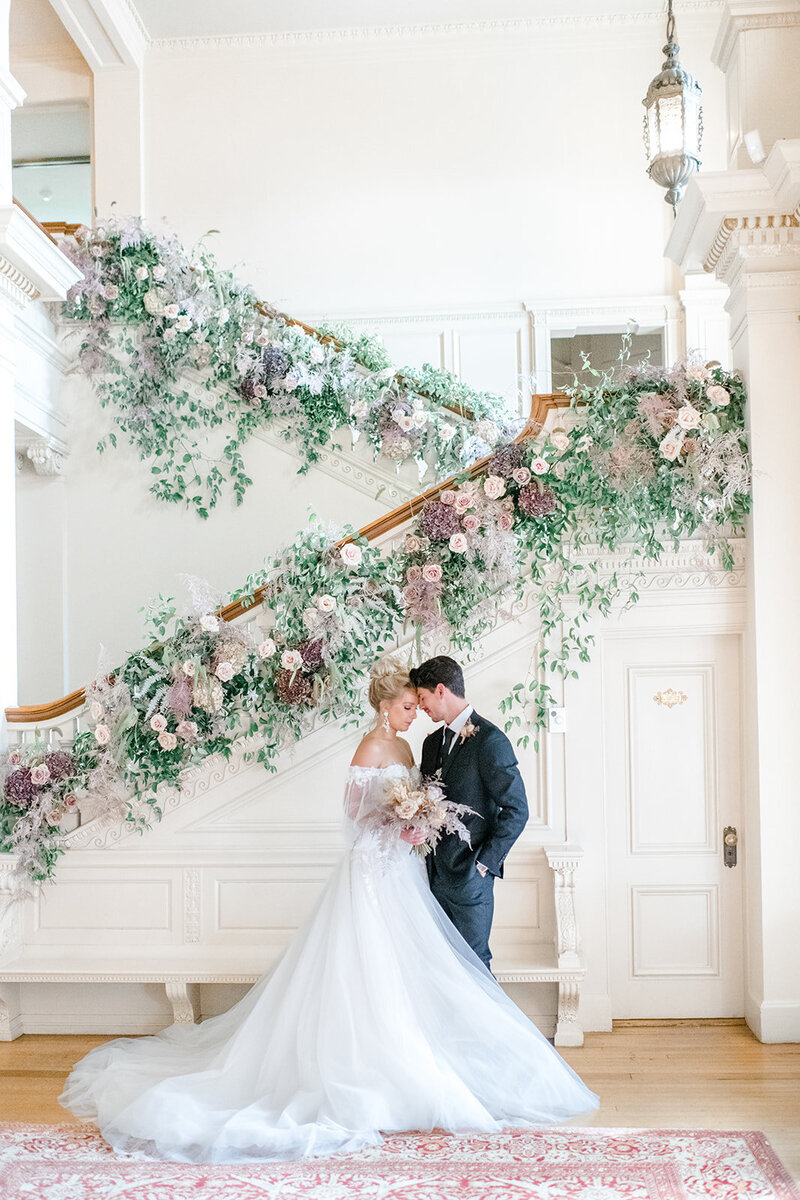 lush floral behind bride and groom