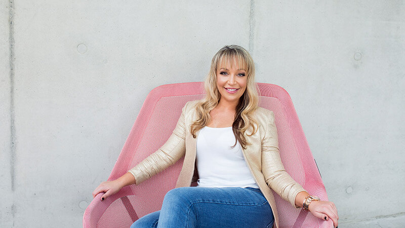 Melissa-Park-sitting-on-pink-chair-960x540-1