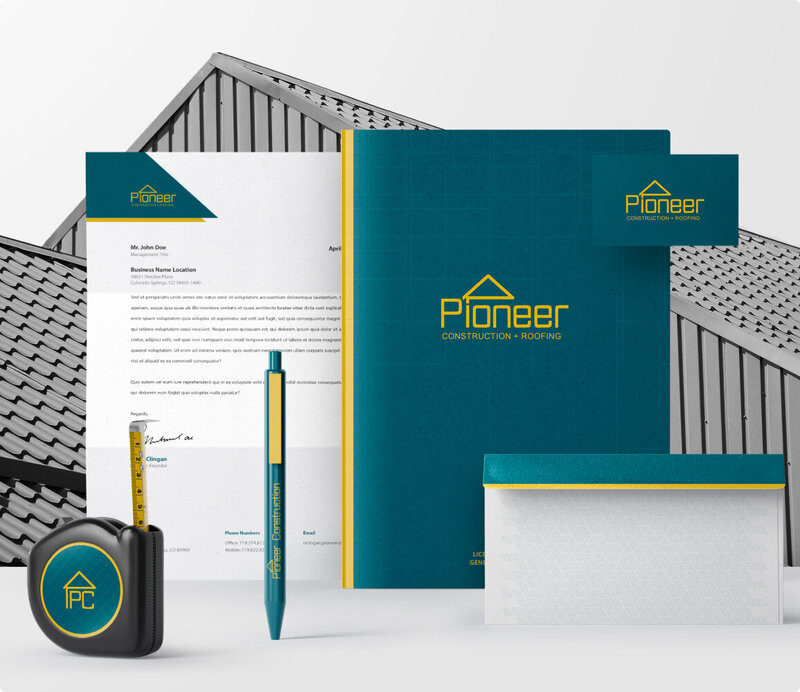 A collage of business stationary items for the brand Pioneer Construction. These items include: letterhead, business card, envelope, folder, pen, and a tape measure.