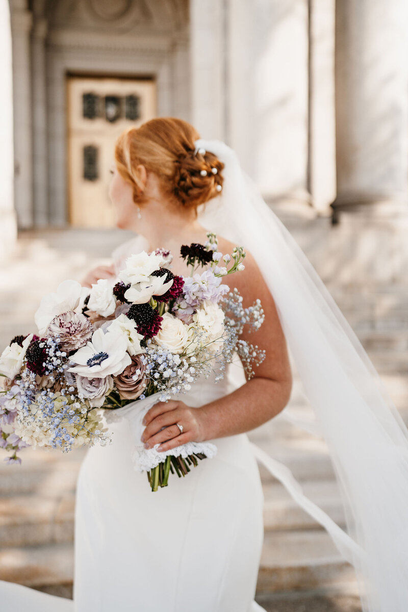 Bride with floral bouquet at Solar Arts