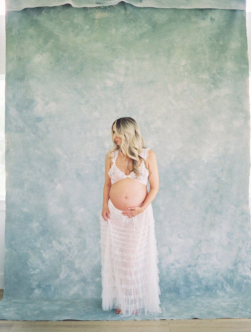 An boudoir inspired maternity session taken in studio