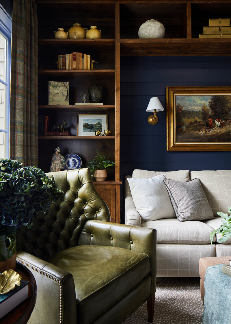 Dark blue office with green chair