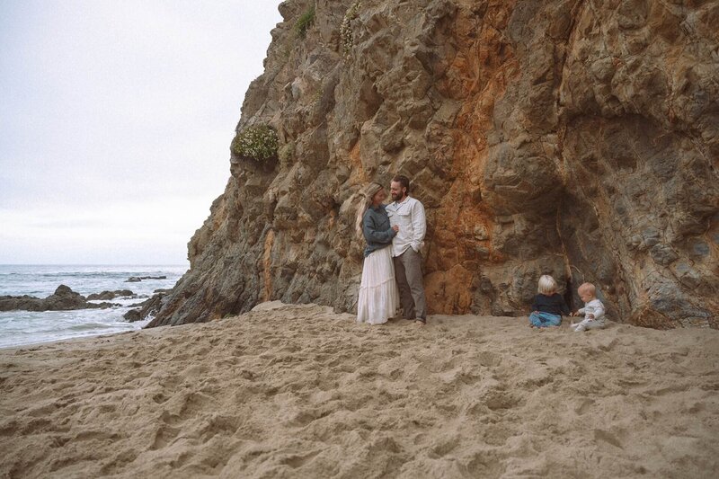 family of four at laguna beach beach with small kids