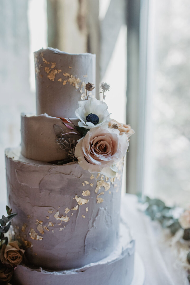 purple wedding cake with gold details