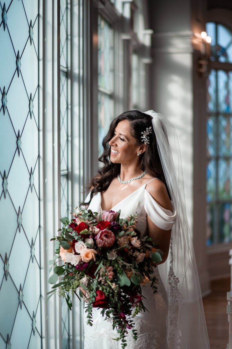 The Disney wedding pavilion windows are gorgeous and bride smiles 