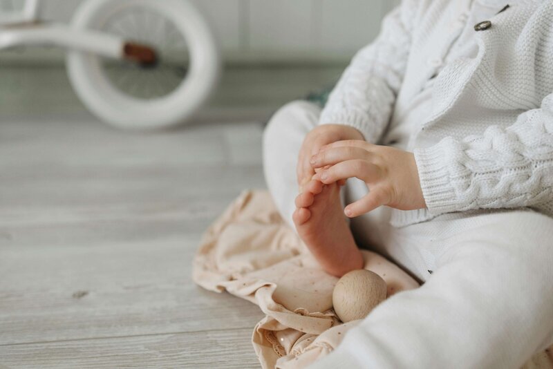 Baby playing with their foot