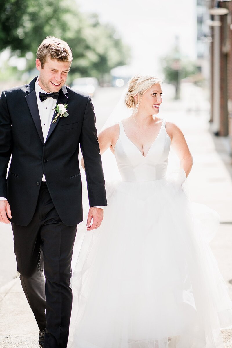 couple walking together by Knoxville Wedding Photographer, Amanda May Photos