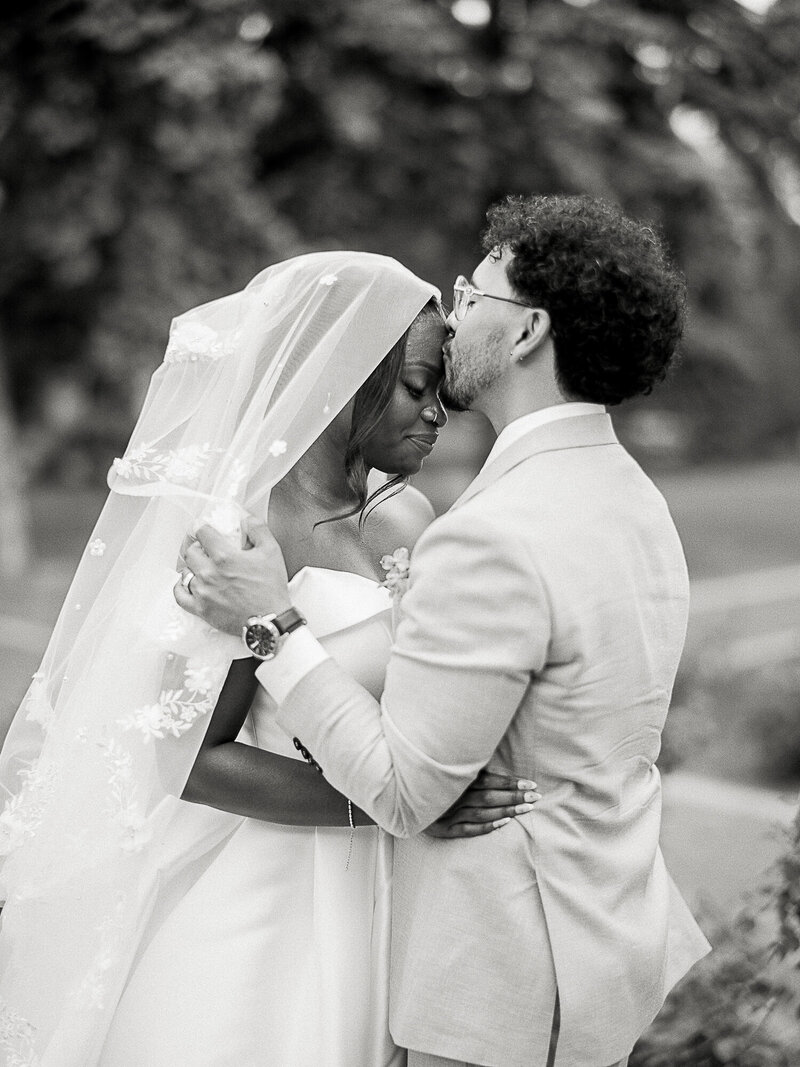 black and white bride and groom at inn on officer's garden