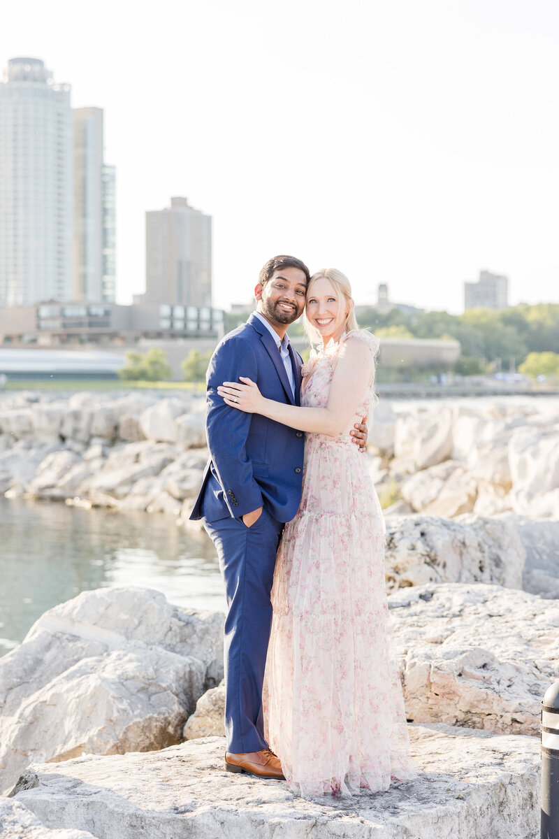 Couple posing on lake Michigan in Milwaukee, Wisconsin. 