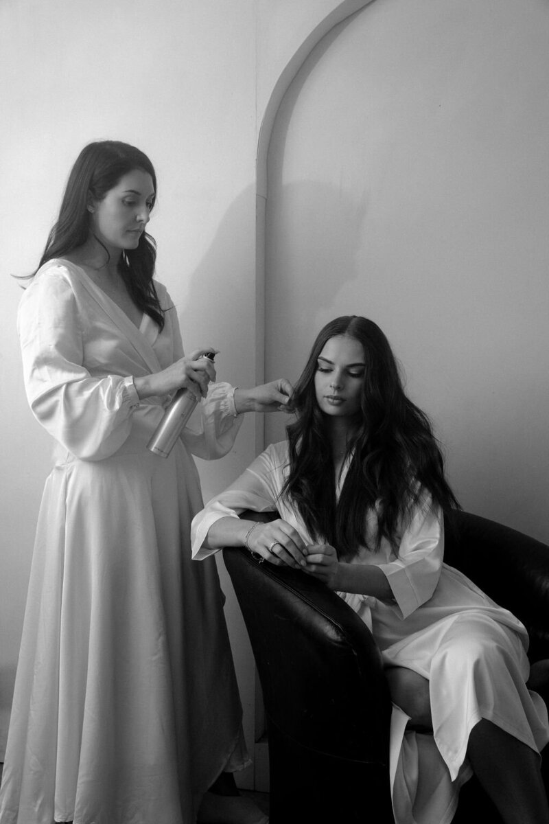 Sarah giving bride her final touchups
