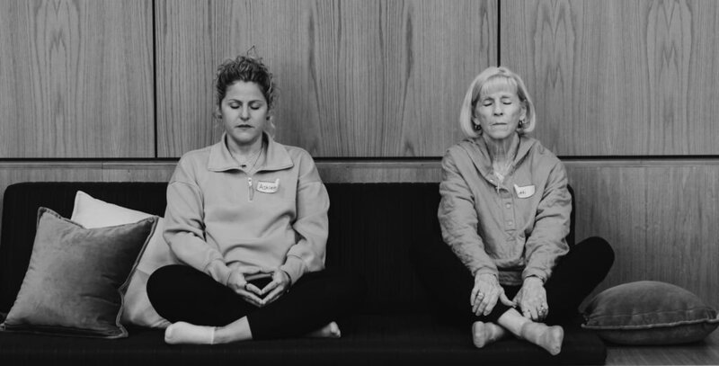 Two caregivers rest at Self-Care retreat.