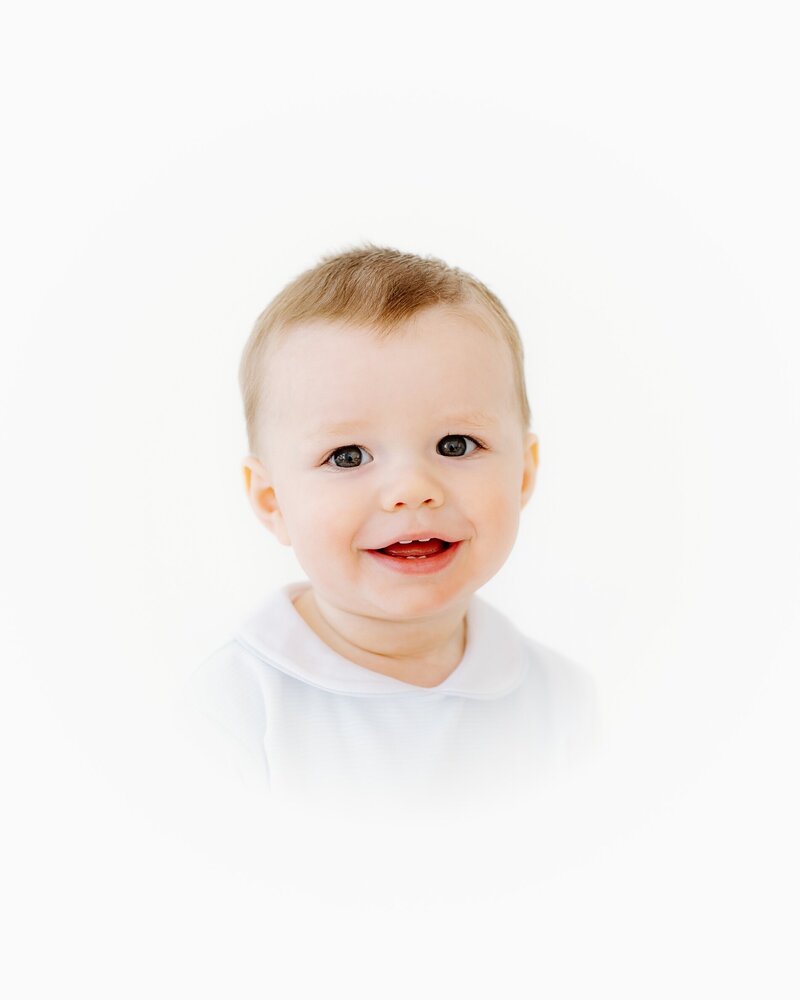 Elegant studio portrait of baby with natural expression – heirloom photographer OKC