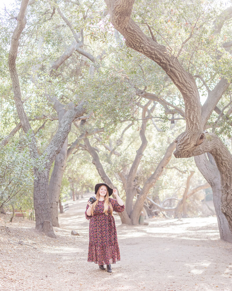 Moira strolling through oak trees in California