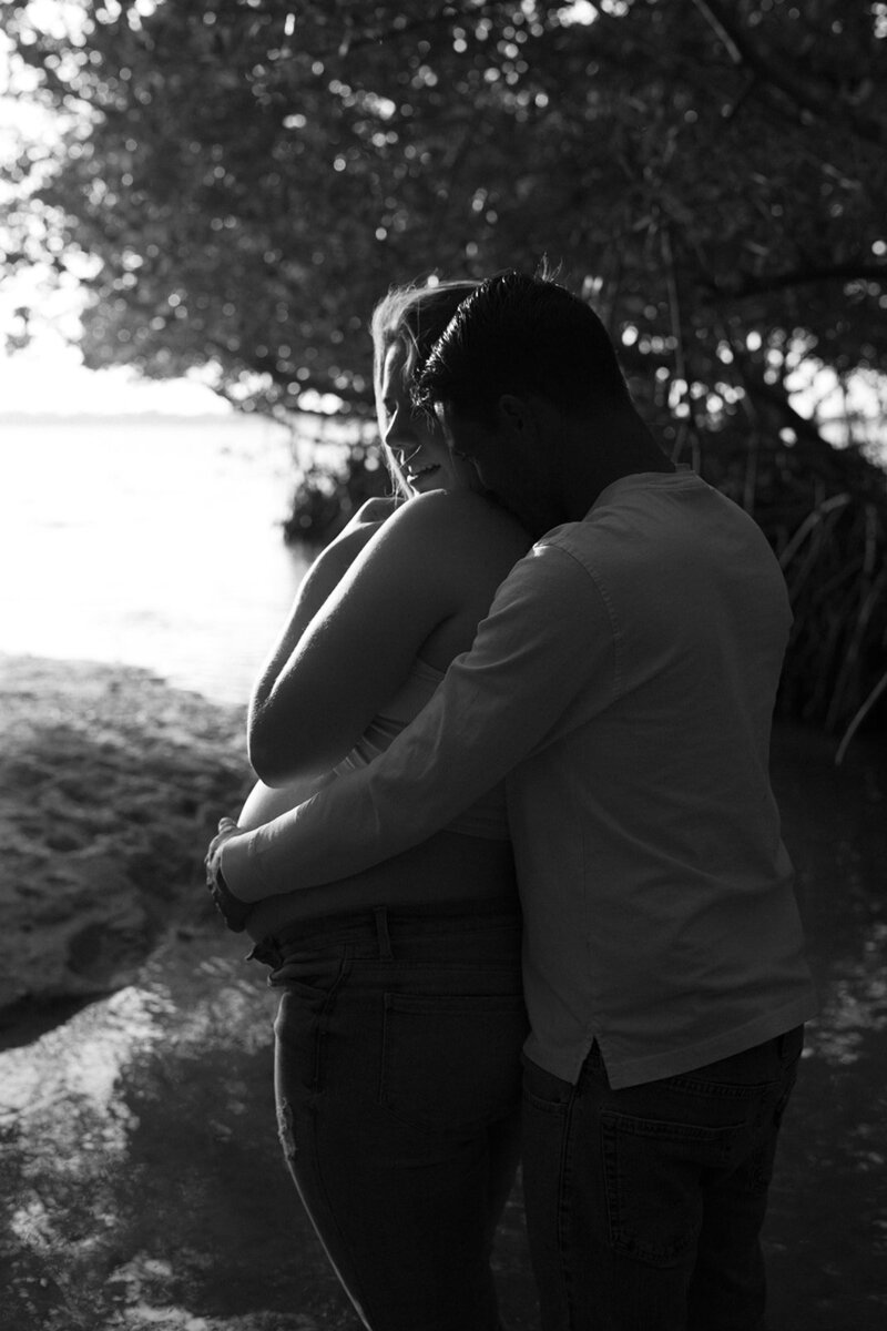 Couple embracing by the ocean