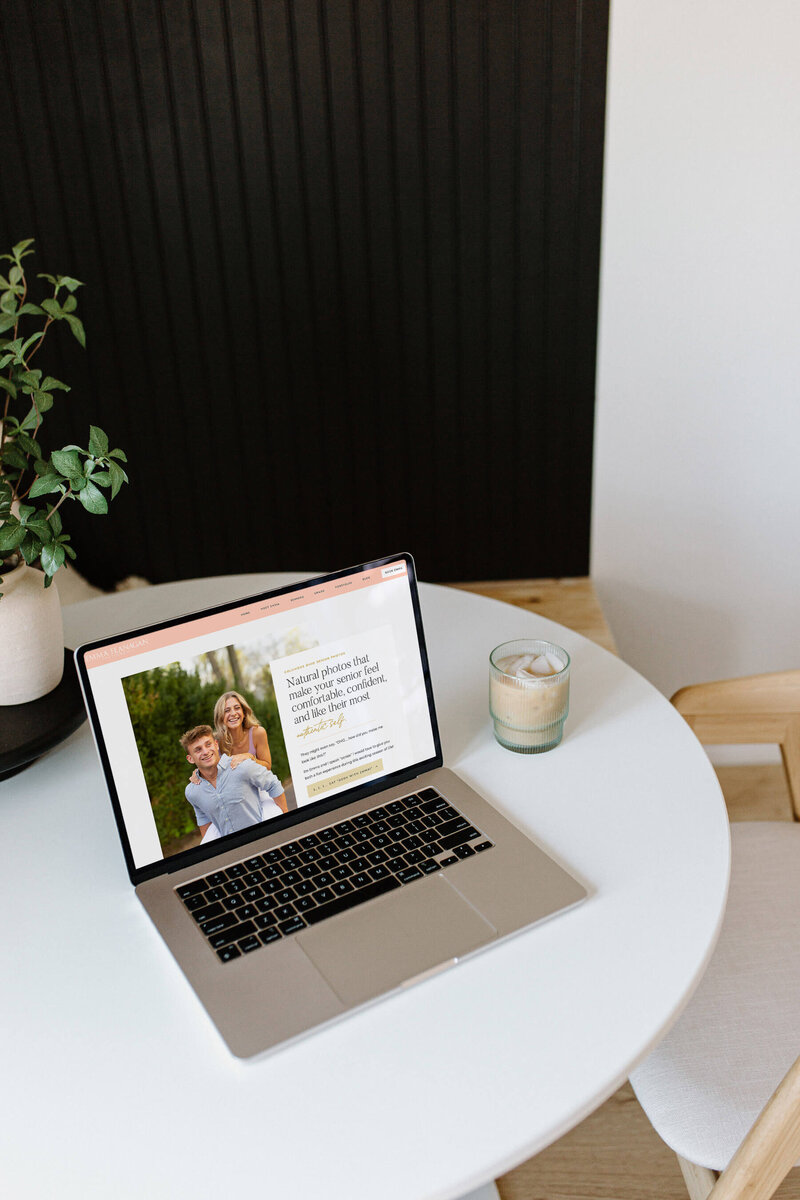 A Showit template customization for a senior photographer shown on a laptop