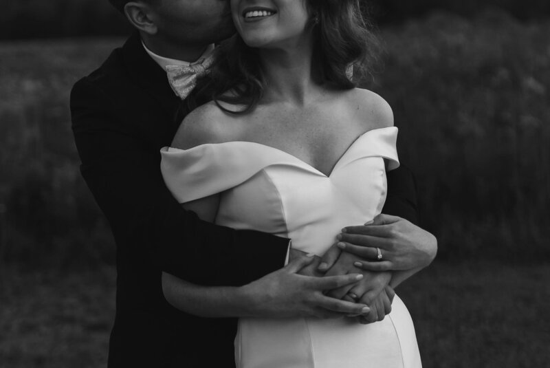 Wedding Photographer Vermont | Sincerely Liz Photography Documentary Wedding, Engagement, Elopement, Maternity and Newborn Photographer in New England | Groom embracing bride in black and white