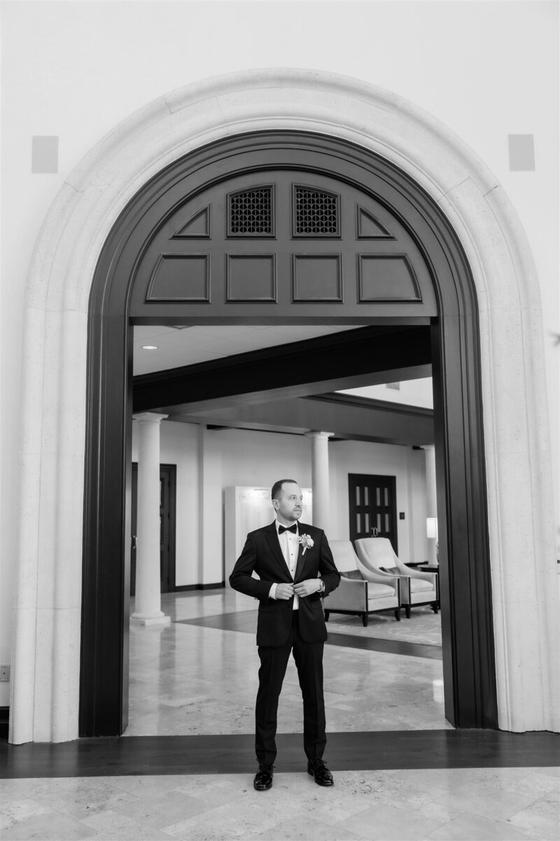 A black and white portrait of groom at the country club of Orlando