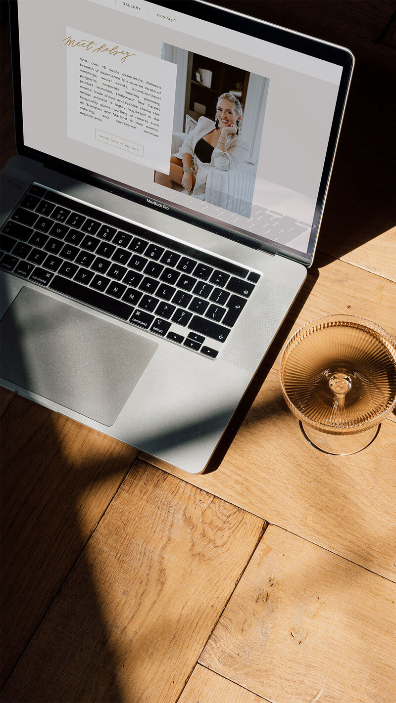 Website mockup for Love & Luxury Events displayed on a laptop beside a chic cocktail