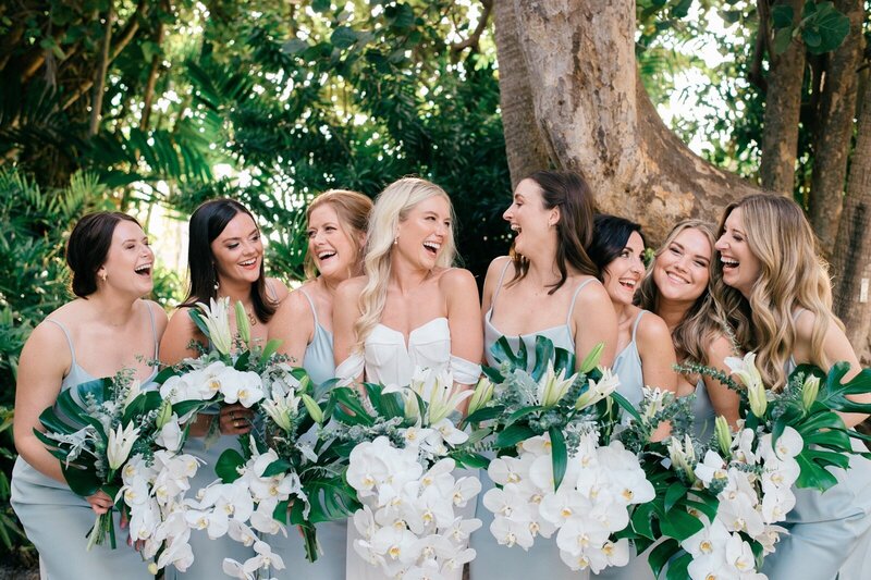 Bridesmaids laughing at bride during Austin wedding.