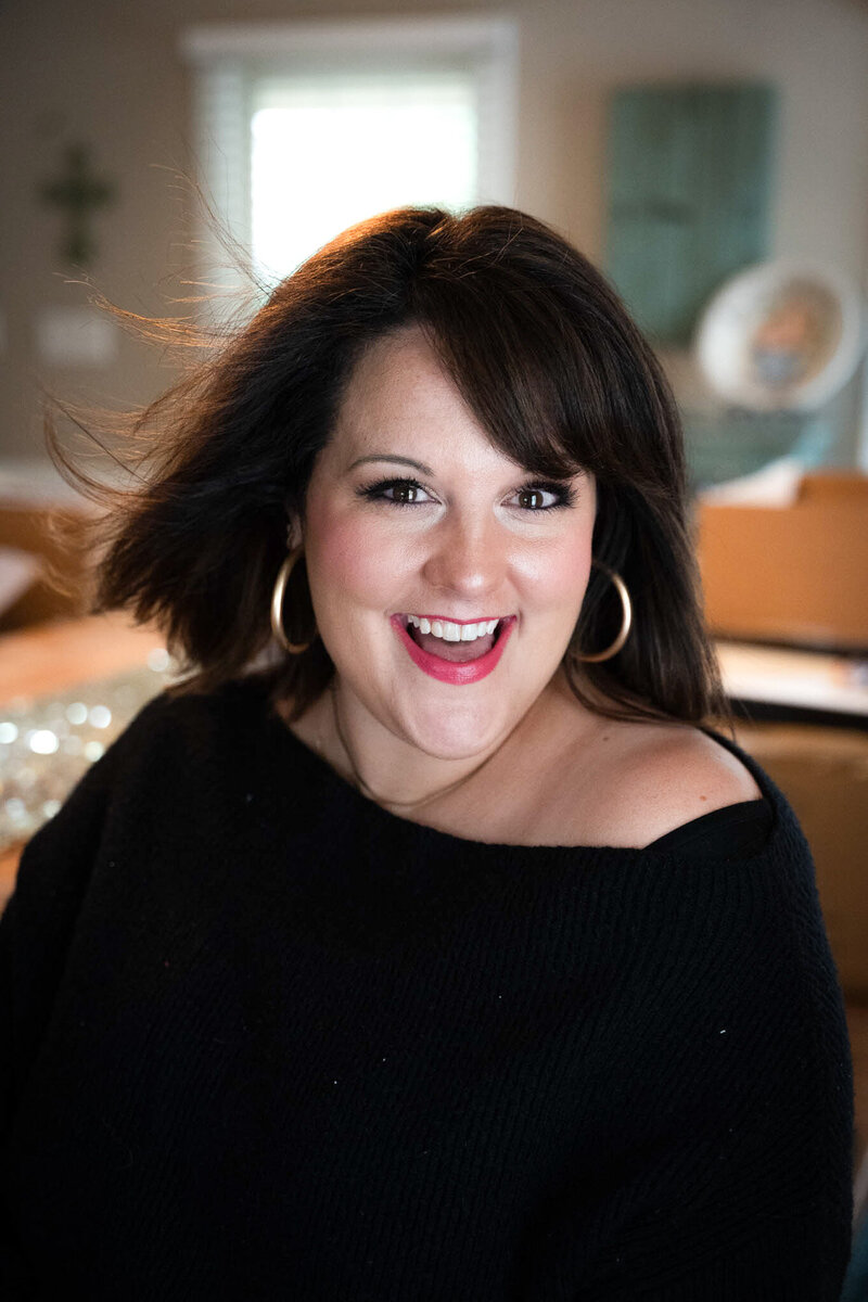 women smiling in black off the shoulder top