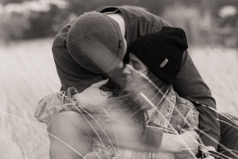 Guy hugging girl in wind