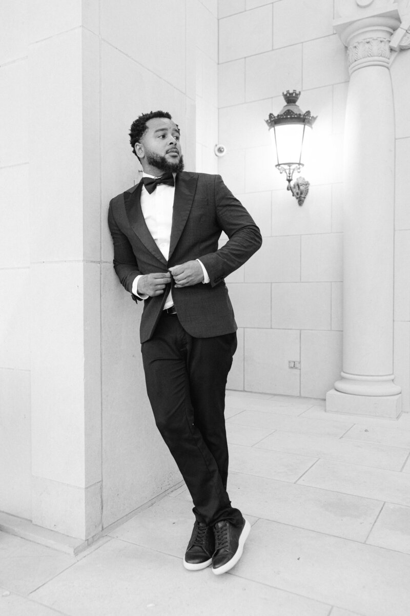 Larry posing in a suit