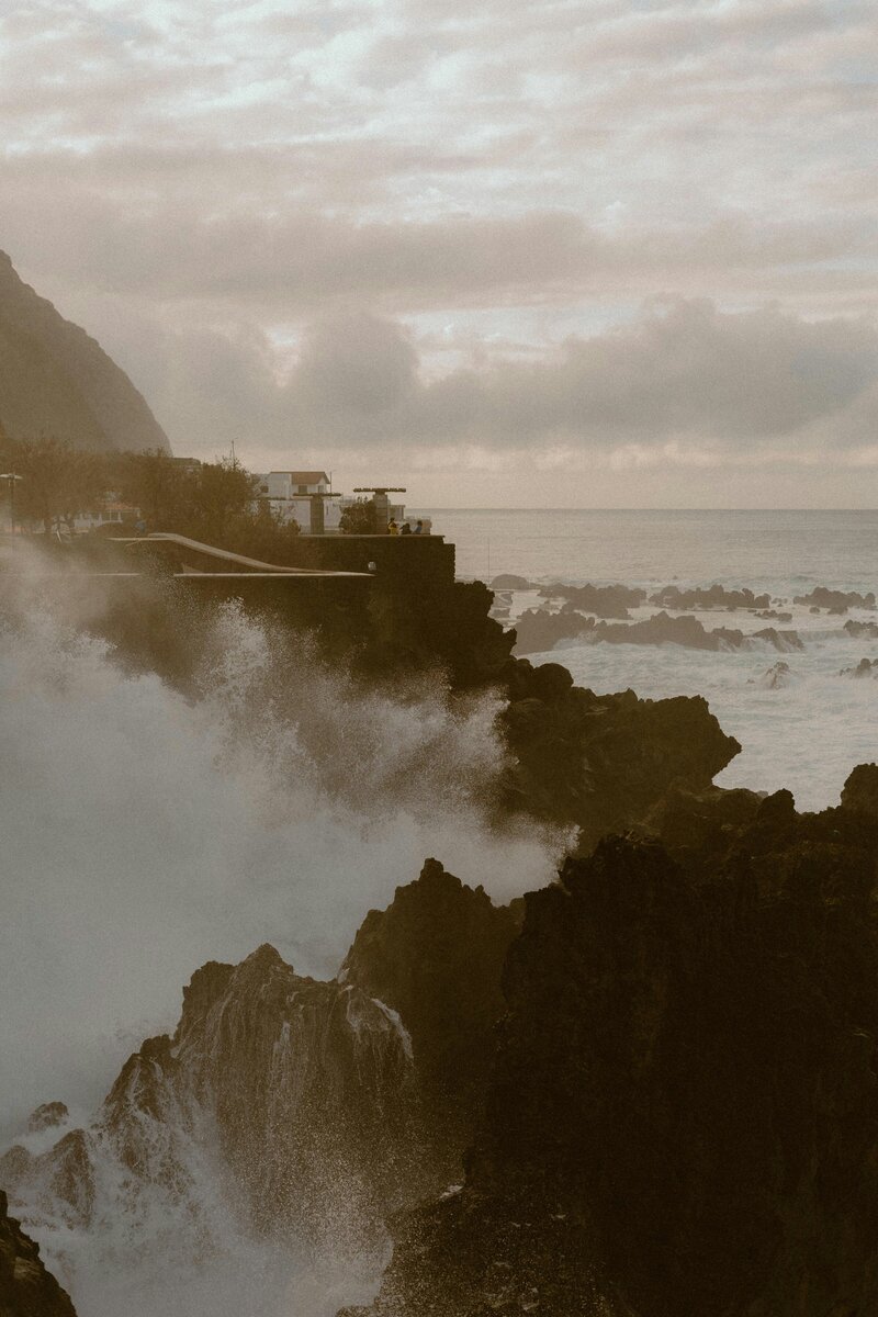 Atlantic waves hitting dark volcanic coasts