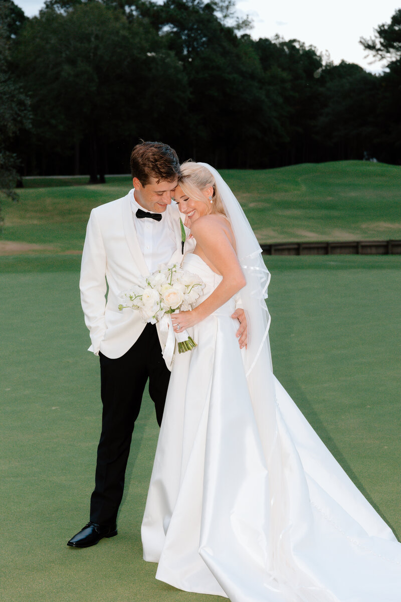 a bride and groom posing on their wedding day at Amaterra Winery in Portland Oregon