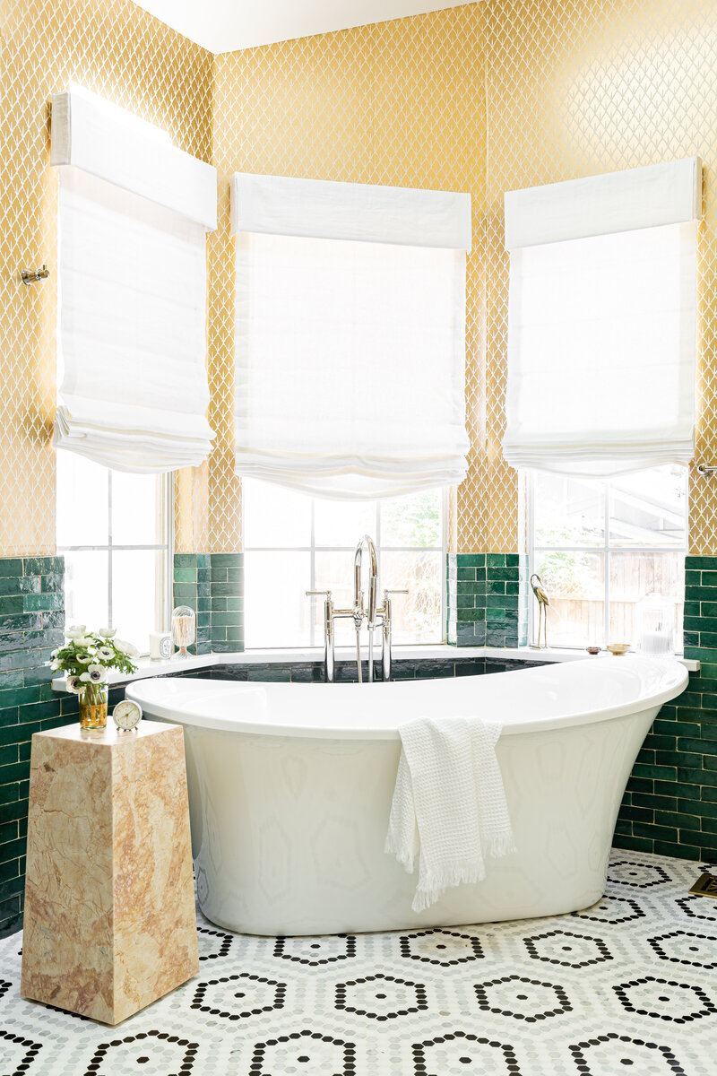 Small space bathroom with black farmhouse wall sink, and black grid shower screen