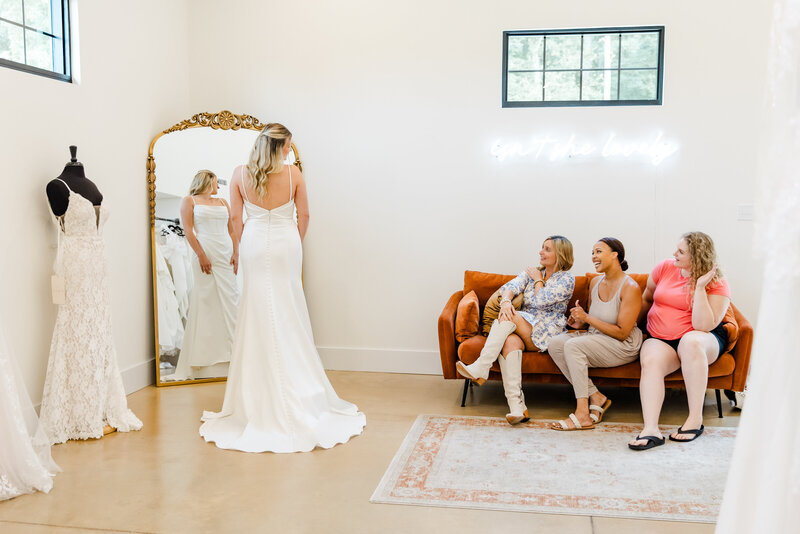Bride entering Leora Bridal with excitement