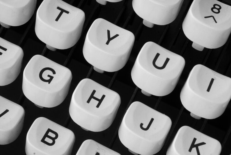 Close-up of a typewriter's keys, representing overcoming creative blocks and reigniting inspiration.