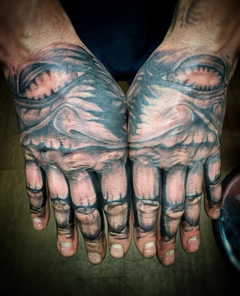 Dark Art Collective hand tattoos
