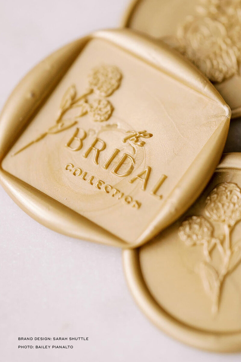 Close-up of gold wax seal used across Anne-Marie Designs packaging
